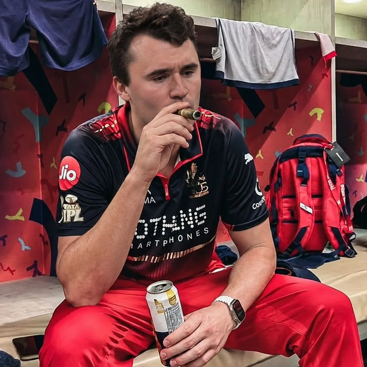 A man sitting on a bench with a drink