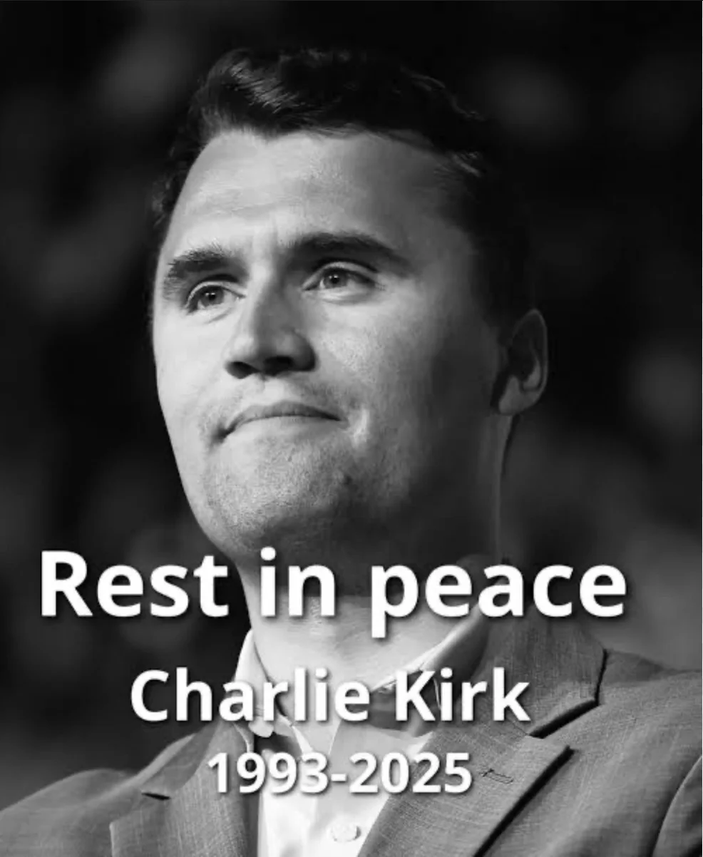A man in a suit and tie with the words rest in peace