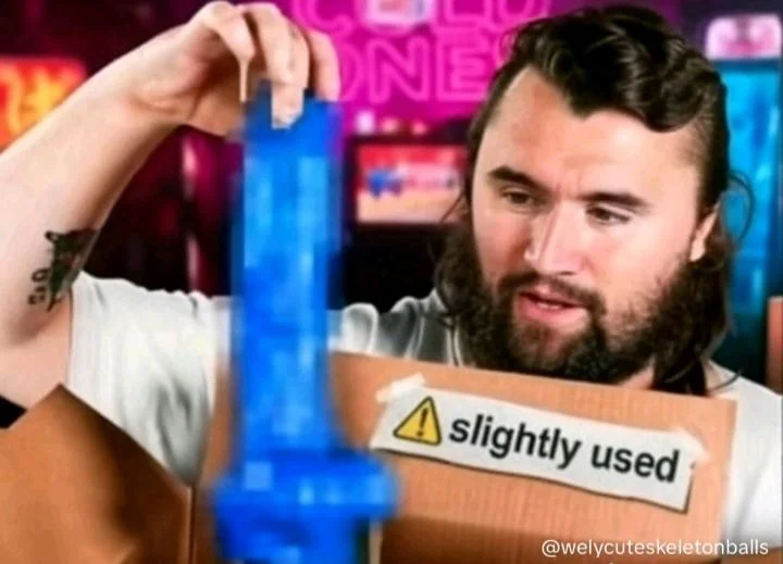 A man holding a box with a sign on it