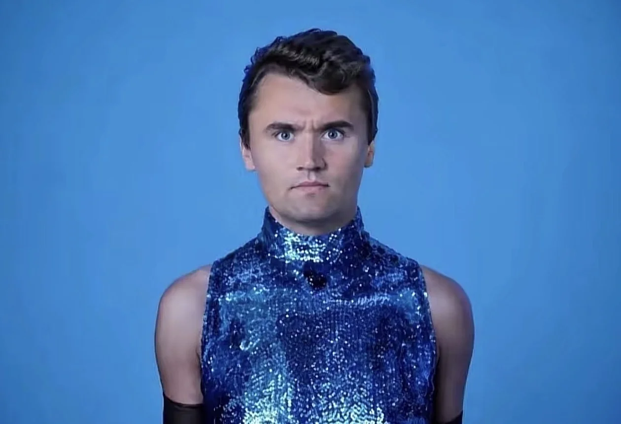 A man in a blue shirt and black gloves