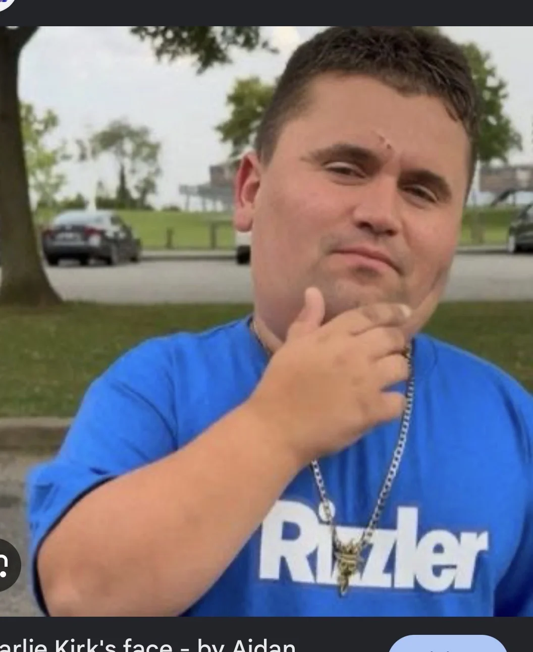 A man in a blue shirt is talking to someone