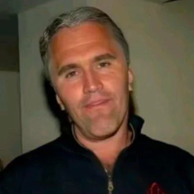 A man in a black shirt and a red shirt