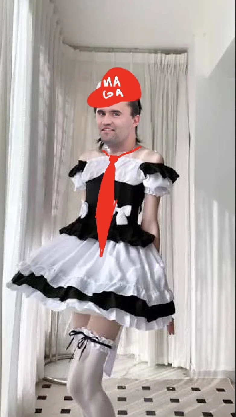 A man in a white dress and red hat