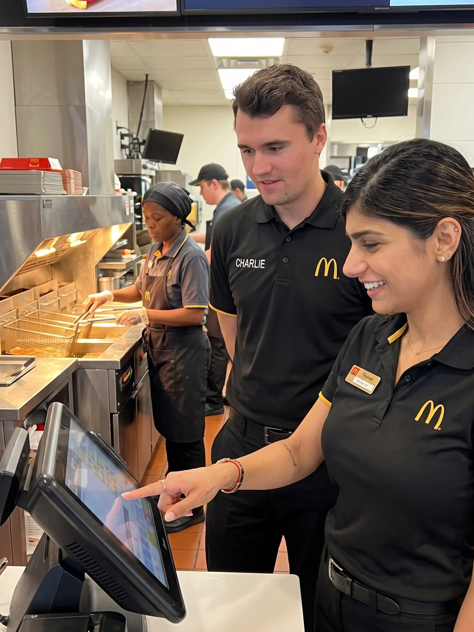 A man and woman in a restaurant kitchen