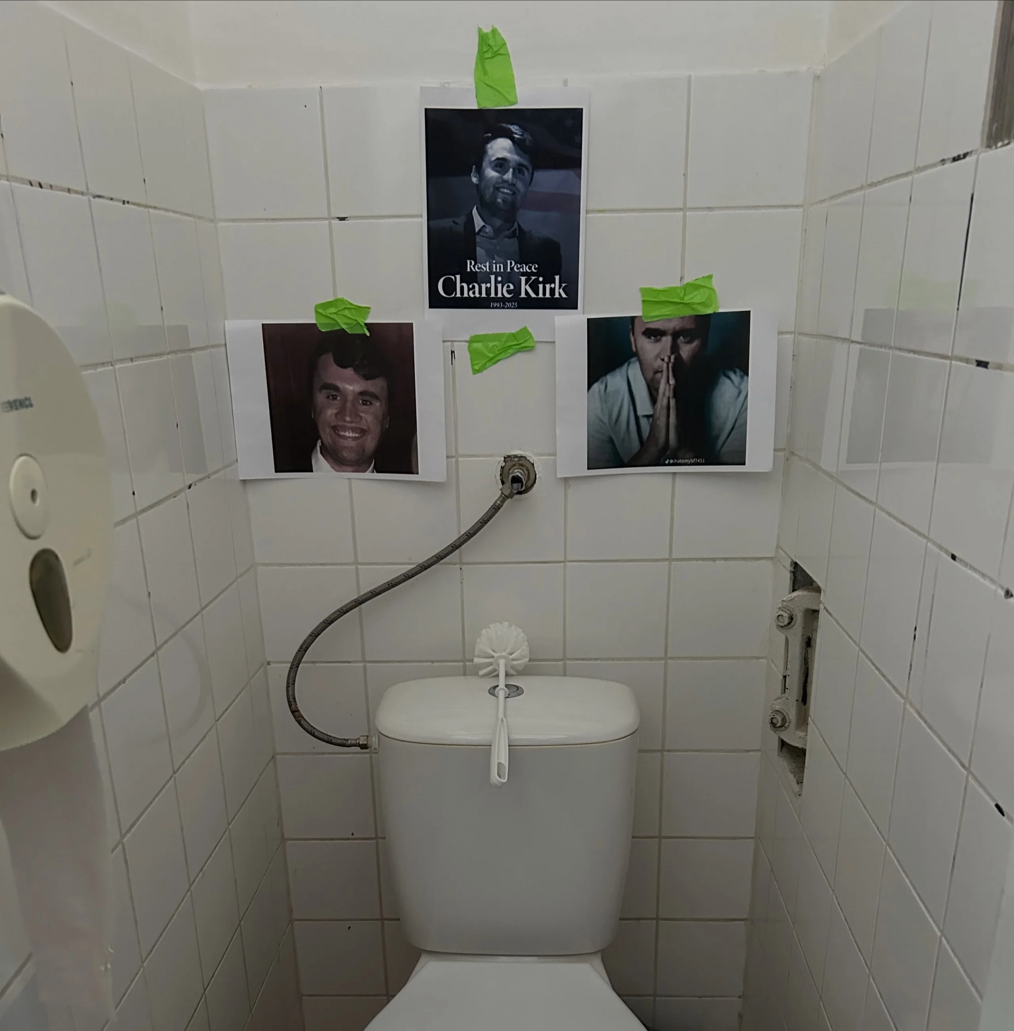 A toilet with a picture of a man on the wall