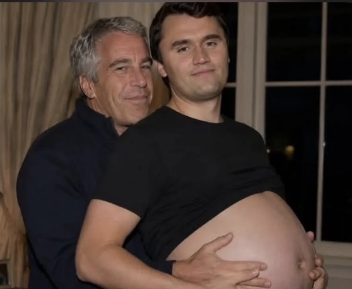 A man hugging his pregnant while he is holding it