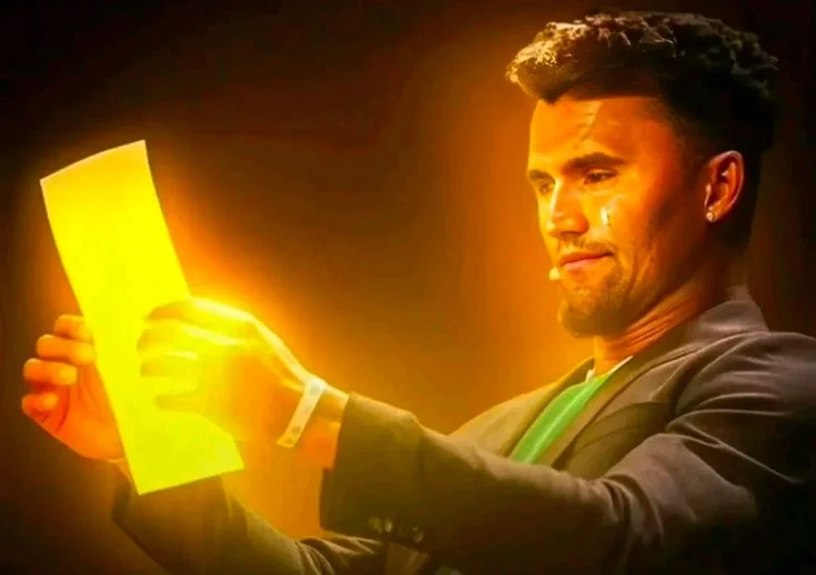 A man holding a yellow light in his hand