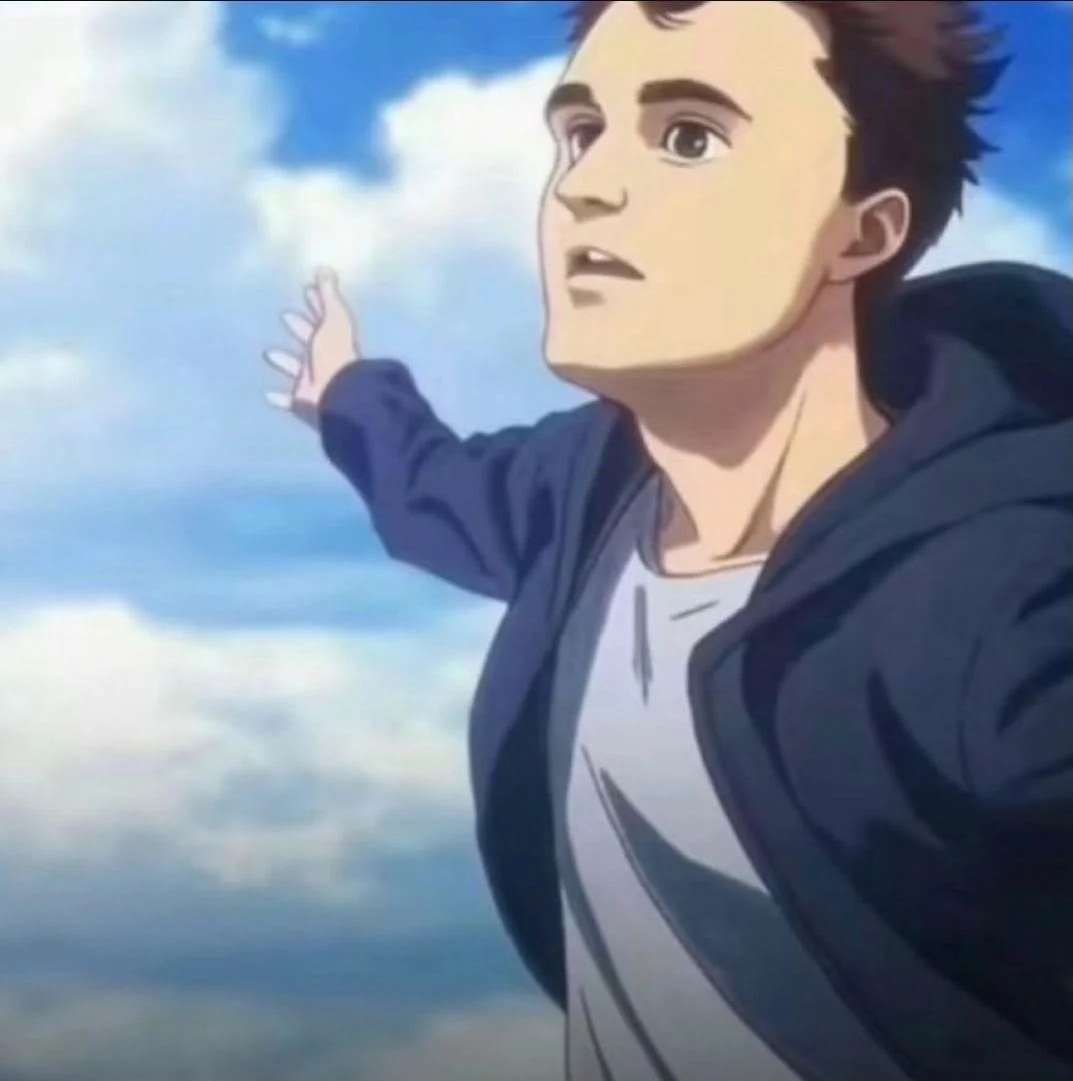A man in a blue jacket is pointing at the sky