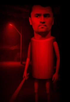 A red light shining on a doll