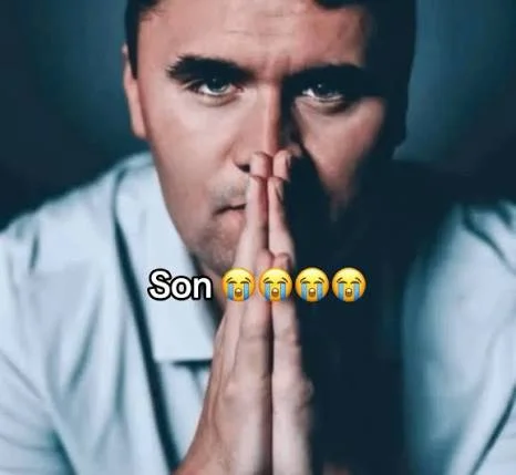 A man with his hands clasped to his face