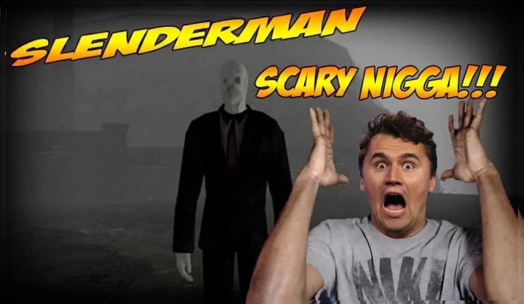 A man in a grey shirt is holding his hands up