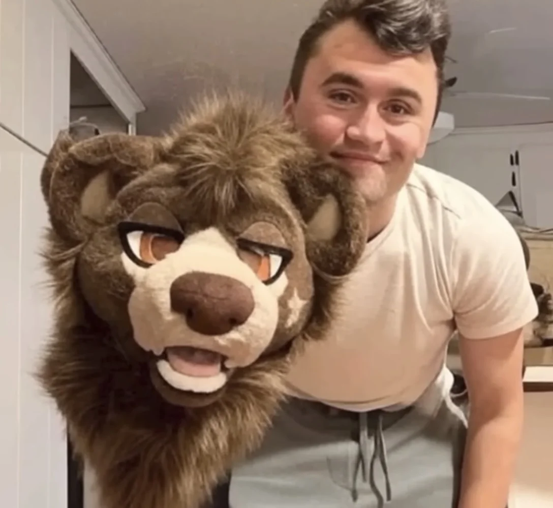 A man holding a stuffed animal in his arms