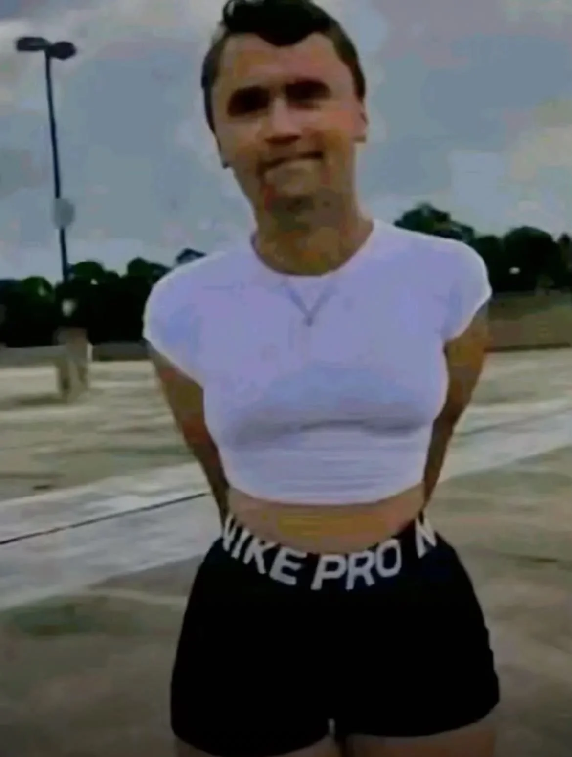 A woman in shorts and a white shirt