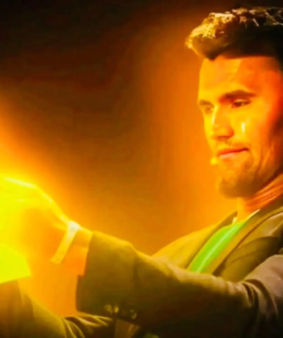 A man in a suit holding a light