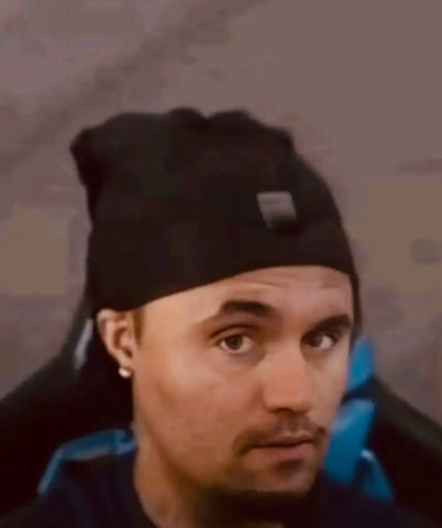 A man wearing a black hat